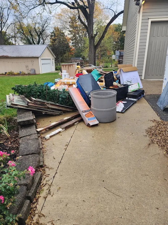 Dumpster being loaded with debris for Residential Dumpster Rental in Monee